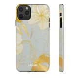 Loulii Blossom™ phone case that shows elegant flowers in white and gold with a gray background