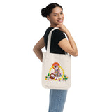 Missy Girl Organic Canvas Tote in natural color that shows a cute doll like girl picking flowers held by a women in front of a white blackground