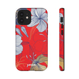 Loulii Blossom™ phone case that shows elegant flowers in white  with a red background