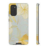 Loulii Blossom™ phone case that shows elegant flowers in white and gold with a gray background