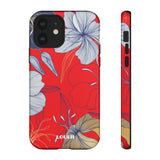 Loulii Blossom™ phone case that shows elegant flowers in white  with a red background