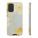 Loulii Blossom™ phone case that shows elegant flowers in white and gold with a gray background