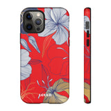 Loulii Blossom™ phone case that shows elegant flowers in white  with a red background