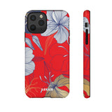 Loulii Blossom™ phone case that shows elegant flowers in white  with a red background