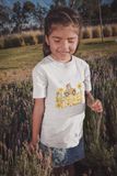 Little girl with a traveling band t-shirt that has a little car in a field of flowers in a field of lavender