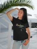Bananeira (banana tree) black t-shirt worn by women at the beach by a palm tree