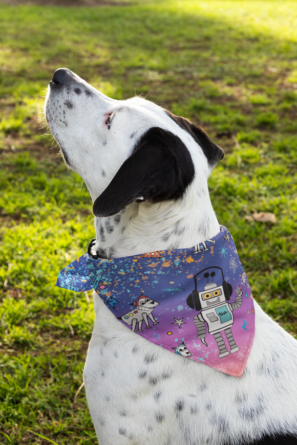 White dog looking up wearing a loulii bot space bandana