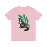 Fox tails tee that shows a black fox in front of green flora in the color pink