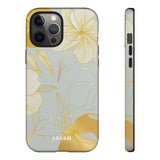 Loulii Blossom™ phone case that shows elegant flowers in white and gold with a gray background