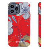 Loulii Blossom™ phone case that shows elegant flowers in white  with a red background