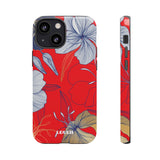Loulii Blossom™ phone case that shows elegant flowers in white  with a red background