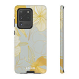 Loulii Blossom™ phone case that shows elegant flowers in white and gold with a gray background