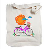Sunny Bike Ride Organic Tote in natural color that shows a cute pink bike in front of a large orange sun