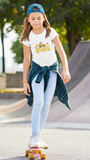 Girl Skate boaring with a traveling music band t-shirt