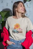 Girl smiling wearing a Loulii Gifts Organic t-shirt