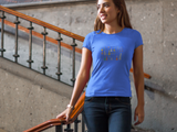 Vases Unisex Tee that has pretty vases with flowers in the color blue worn by a yound women walking down a stair case